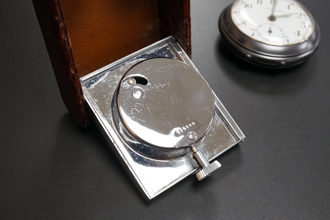 A Finnegan's leather cased travelling timepiece and a base metal Glow Worm pocket watch.